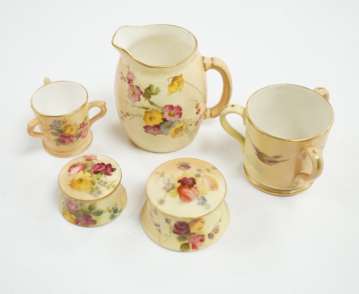 Thirteen Worcester miniature cabinet pots and jugs including floral blush ivory examples, largest 7cm high. Condition - mostly fair to good